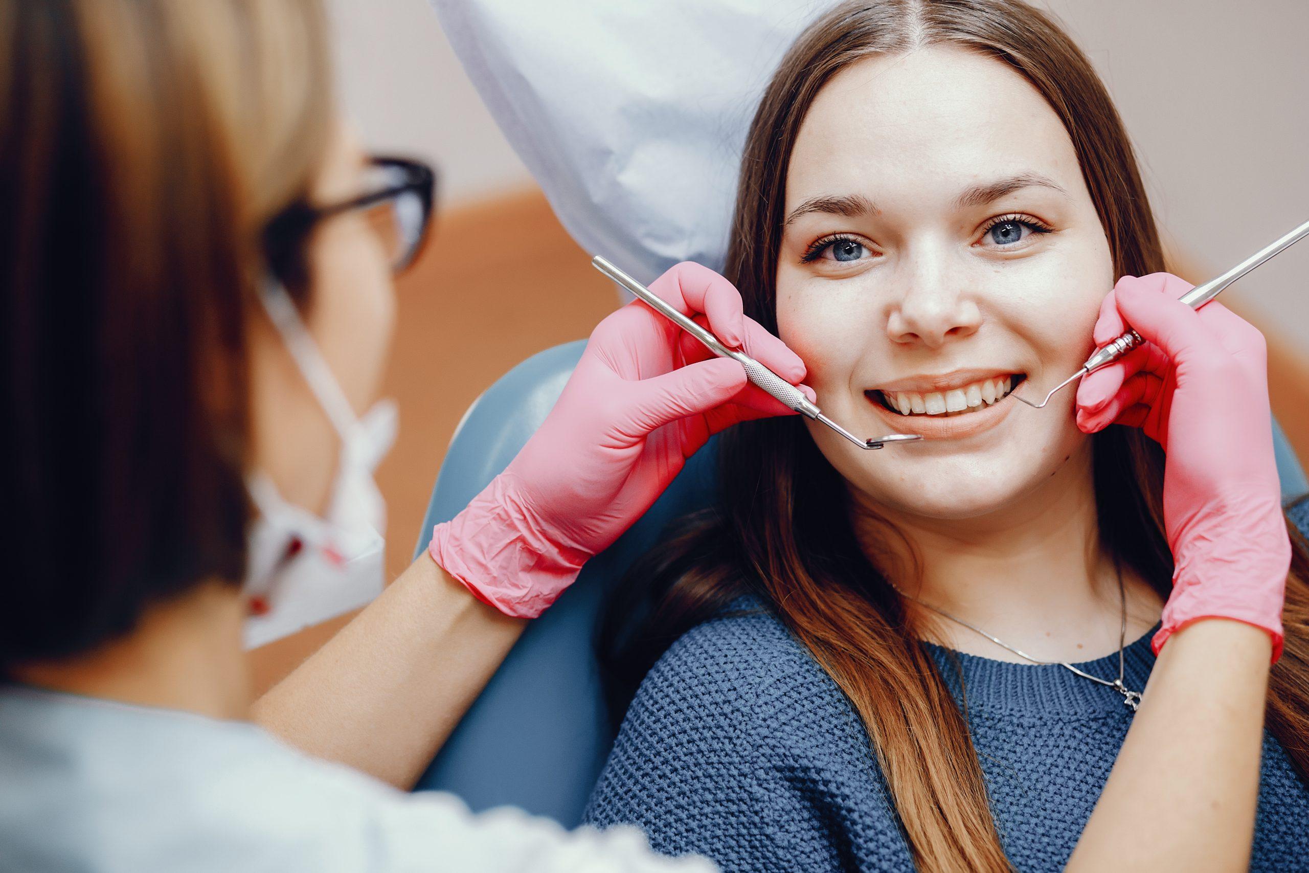 Beautiful girl sitting dentist s office scaled 1